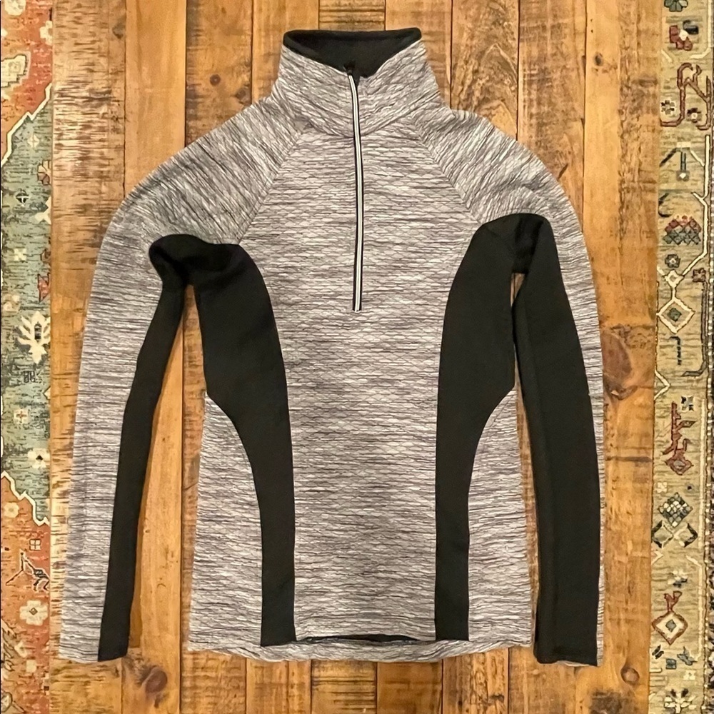Woman’s 1/4 zip pullover compression jacket